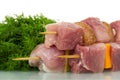 Pieces of raw pork, vegetables, mushrooms on wooden skewers and Royalty Free Stock Photo