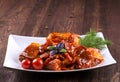 Pieces of raw pork on white plate. Chunks of barbecue in a sauce Royalty Free Stock Photo