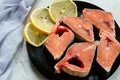 Pieces of red fish with lemon