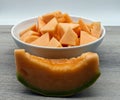 Pieces of refreshing Melon on wooden table. Fresh fruit