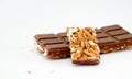pieces of rice  chocolate bar over white background Royalty Free Stock Photo