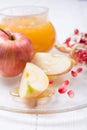 Pieces ripe pomegranate, honey and apple