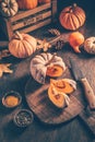 Pieces with ripe pumpkin seeds on a cutting board