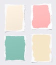 Pieces of ripped colorful blank notebook paper stuck on gray background