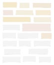 Pieces of ripped white, lined blank note paper, brown sticky, adhesive tapes are stuck on white wall Royalty Free Stock Photo