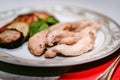 Pieces of roasted chicken and vegetables on plate Royalty Free Stock Photo