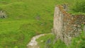 Pieces of ruined ancient mansory near mountain river