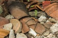 Pieces of shattered and broken terracotta pots scattered on the ground Royalty Free Stock Photo