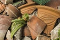 Pieces of shattered and broken terracotta pots scattered on the ground Royalty Free Stock Photo