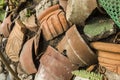 Pieces of shattered and broken terracotta pots scattered on the ground Royalty Free Stock Photo