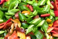 Pieces sliced sweet red, yellow and green pepper on table. Top view. Royalty Free Stock Photo