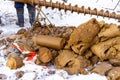Pieces of soil from well are dumped in a heap, geological drill extracted from the well lies on support during sampling Royalty Free Stock Photo
