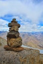 pieces of stones balancing over another as a symbol of peace of mind and balance