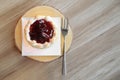 Pieces of strawberry tart pie on wooden plate Royalty Free Stock Photo