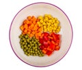 Pieces of pepper, carrot, green peas, corn in ceramic bowl isolated on white. Top view Royalty Free Stock Photo