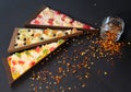 Pieces of sweet pizza, paprika and mustard seeds Royalty Free Stock Photo