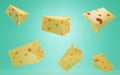 Pieces of Swiss, Italian or Dutch hard cheese. Triangular lump block of cheese Cheddar with holes. Ad and promotion of Royalty Free Stock Photo