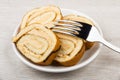 Pieces of swiss roll cake in saucer and fork Royalty Free Stock Photo