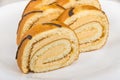 Pieces of swiss roll cake on white glass plate Royalty Free Stock Photo