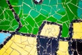 pieces of tiles of different patterns and bright colors forming abstract figures.