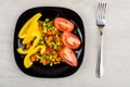 Pieces of tomato and sweet pepper, vegetable mix in plate Royalty Free Stock Photo