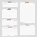Pieces of torn white blank lined note paper with colorful sticky tape on gray background Royalty Free Stock Photo