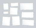 Pieces of torn white blank, note, copybook, notebook strips, sheets inserted into gray cut paper Royalty Free Stock Photo