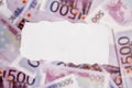 Pieces of torn white paper with FINANCE word on money blur backg Royalty Free Stock Photo