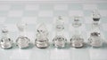 Pieces of transparent chess, King,  Queen, KnightHorse , Bishop, Rook, Pawn . Transparent chess figures on chessboard Royalty Free Stock Photo