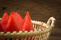 pieces watermelon in basket on old wooden Royalty Free Stock Photo