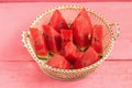 pieces watermelon in basket on pink wooden Royalty Free Stock Photo