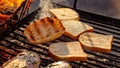 Pieces of white bread are grilling on the open fire outside Royalty Free Stock Photo