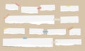 Pieces of white torn note paper with colorful adhesive, sticky tape are stuck on brown diagonal background Royalty Free Stock Photo