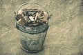 Pieces of wood in a bucket. Vintage toning, front and top view Royalty Free Stock Photo