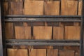 Pieces of wooden plank wall with black steel shelves