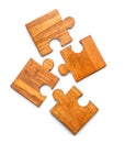 Pieces of wooden puzzle on white background