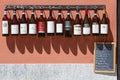 Piedmont wine bottles collection in front of winery, Barolo, Italy