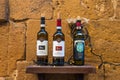 Pienza, Italy - January 4, 2019: Various bottles of tuscan wine as decoration of the wine shop or restaurant in Pienza, Tuscany,