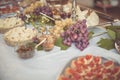 Pecorino cheese from Pienza, grapes and honey on the table Royalty Free Stock Photo