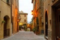 Pienza village characteristic narrow street view at sunrise, Tuscany, Italy Royalty Free Stock Photo