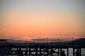 Pier on the background of pink sunset