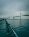 Pier 14 and the Bay Bridge on a foggy night, San Francisco, California Royalty Free Stock Photo