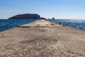 Pier on Beach Greco, Budva, Montenegro leading to Saint Nikola Island