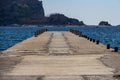 Pier on Beach Greco, Budva, Montenegro leading to Saint Nikola Island