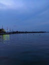 a pier on the beach side at dusk