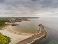 Pier and beach in Spiddal town, county Galway, Ireland. Aerial view, Cloudy sky. Landscape