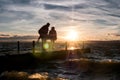 Pier with blurred couple at dusk Royalty Free Stock Photo