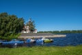 A pier with boats in Kamenny Brook and the Church of Demetrius on Blood