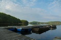 A pier with boats in a Swedish lake