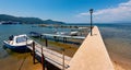 Pier with boats in Thasos town Limenas, the Aegean seacoast, Greece. Holiday destination